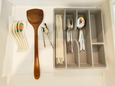 a tray with utensils sitting on a table at Chambers Service Suites Amazing View KLCC in Kuala Lumpur