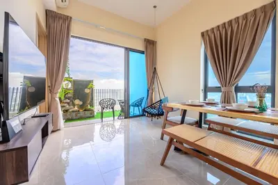 a living room with a table and a large window at Penthouse Sky Jacuzzi At KLCC in Kuala Lumpur