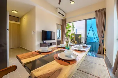 a living room with a table and a large window at Penthouse Sky Jacuzzi At KLCC in Kuala Lumpur