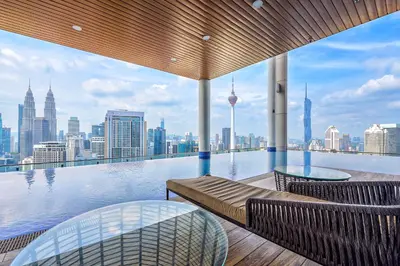 a swimming pool with a view of the city at Penthouse Sky Jacuzzi At KLCC in Kuala Lumpur