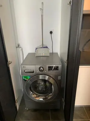 a washer and dryer in a room at Scarletz Suites KLCC by GC Luxury Suites in Kuala Lumpur