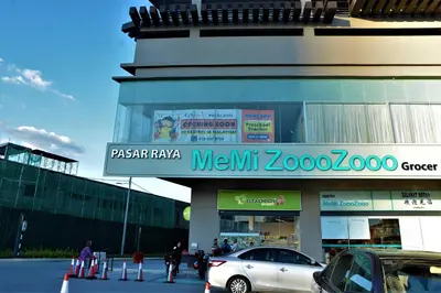 a car parked in front of a meijeraz store at Suasana Homestay Kewingston Platz in Kuala Lumpur