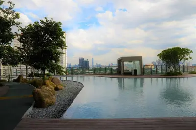 a large swimming pool in the middle of a city at Suasana Homestay Kewingston Platz in Kuala Lumpur