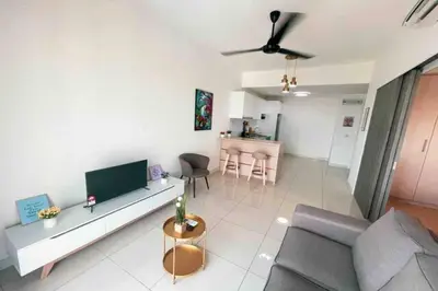 a living room with a couch and a tv at Continew Residence Cozy Suite by GUESTONIC in Kuala Lumpur