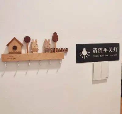 a shelf with three cats and a bird house at KLCC Night View Spacious Muji MITEC 3min 121CAE in Kuala Lumpur