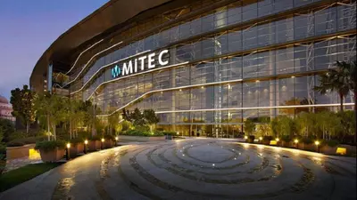 a building with a white sign on the side of it at KLCC Night View Spacious Muji MITEC 3min 121CAE in Kuala Lumpur