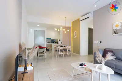 a living room with a couch and a table at The Pano @ Jalan Ipoh by Lily and Loft in Kuala Lumpur