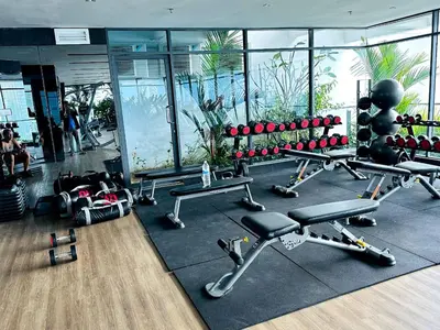 a gym with cardio equipment in a building at The Colony Stay Well studio with KL View in Kuala Lumpur