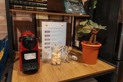 a table with a blender and a plant on it at Wizarding Residence near KLCC link LRT & Mall in Kuala Lumpur