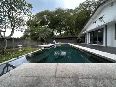 a swimming pool in the backyard of a house at Bungalow with Pool Karaoke PJ 12 in Petaling Jaya