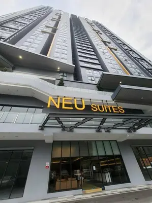a building with a new suites sign on it at Contemporary 2R2B Studio 10 minutes from KLCC in Kuala Lumpur