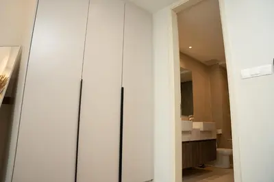 a bathroom with a toilet and a glass door at OOAK SUITES AT MONT KIARA KUALA LUMPUR in Kuala Lumpur
