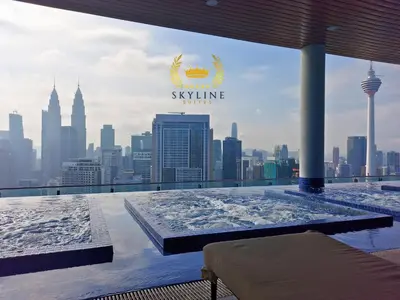 a hot tub on top of a building with a city skyline at The Colony Skyline Suites KLCC in Kuala Lumpur