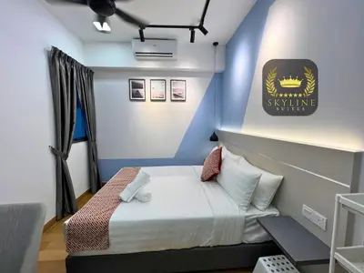 a room with a bed with a sign on the wall at The Colony Skyline Suites KLCC in Kuala Lumpur