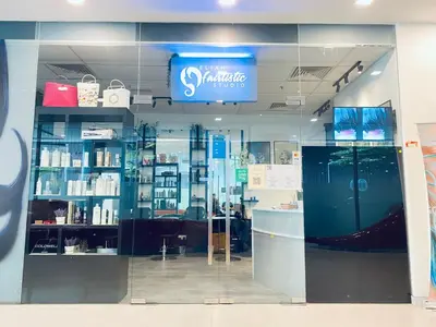 a shop with a sign on the wall of a store at Mercu Summer Suites KLCC by GRIHOZ Homestay in Kuala Lumpur