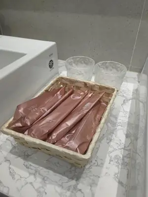 a tray of wrapped hot dogs sitting on a counter at TheOoak suite 4pax cozy home stay @mont kiara in Kuala Lumpur