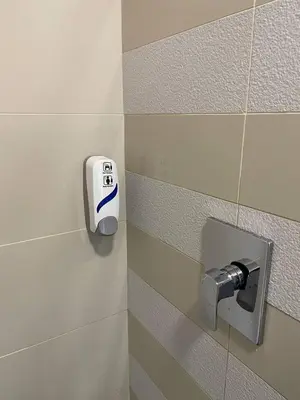 a bathroom with a soap dispenser on a wall at 100Mbps DesaPark MontKiara Publika Mitec Kepong Menjalara Segambut 7Pax in Kuala Lumpur