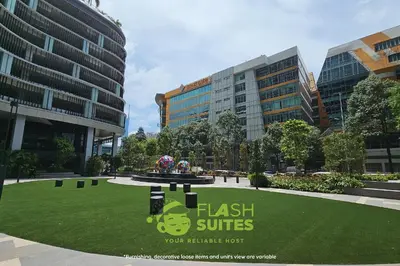 a park with a sign in front of some buildings at Trion Premium Suites @ KL in Kuala Lumpur