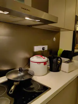 a frying pan on a stove in a kitchen at 5 Bukit Bintang 5 minutes to Alor Street Bukit Ceylon KLCC Pavilion Apt 3R2B 10 pax in Kuala Lumpur