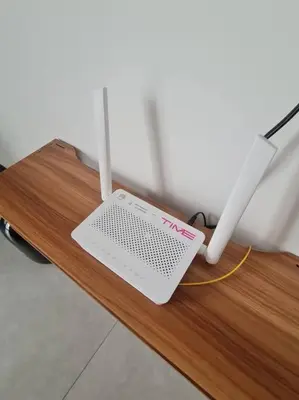 a laptop computer sitting on a wooden table at 2R2B Apartment 10 mins to KLCC in Kuala Lumpur