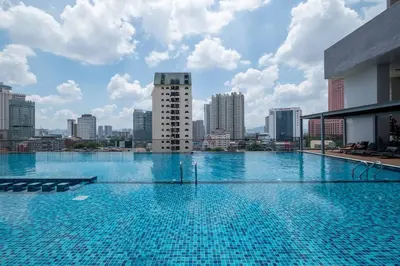 a large swimming pool on top of a building at Chambers near PWTC SunwayPutra KLCC InfinityPool in Kuala Lumpur