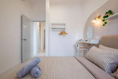 a bedroom with a bed and a desk and a sink at Chambers near PWTC SunwayPutra KLCC InfinityPool in Kuala Lumpur