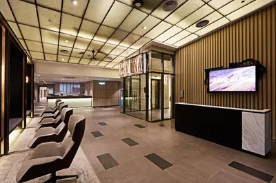 a conference room with chairs and a flat screen tv at Ceylonz Suite, Bukit Bintang by MK HOME in Kuala Lumpur