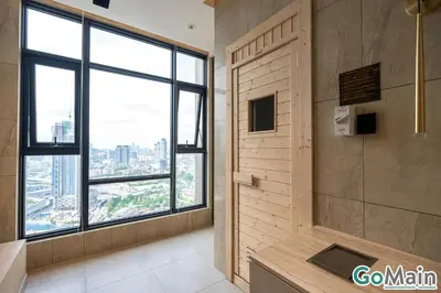 a bathroom with a shower with a large window at Axon Bukit Bintang Pavillion KL KLCC by GoMain in Kuala Lumpur