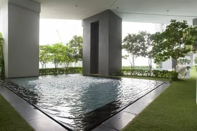 a swimming pool in the middle of a building at TTs HOME3 Mews 4-8Pax Pavilion KLCC Kuala Lumpur in Kuala Lumpur