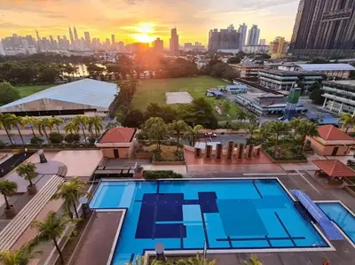 an overhead view of a city with a swimming pool at 3BR 8PAX KL City Centre KLCC View Ampang Boulevard Condo in Ampang
