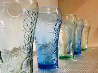 a row of glass vases sitting on a table at 3BR 8PAX KL City Centre KLCC View Ampang Boulevard Condo in Ampang