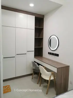 a dressing room with a desk and a mirror at I-Concept Homestay in Kuala Lumpur