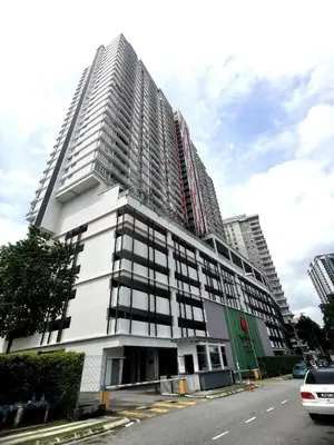 a tall white building with windows on a street at MhPlatinum Gombak ShareHouse Room in Kuala Lumpur