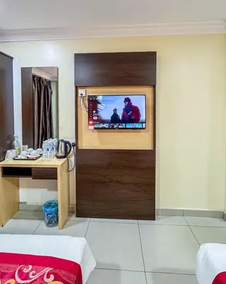 a room with a tv on a wall at THE STARION HOTEL BUKIT BINTANG in Kuala Lumpur