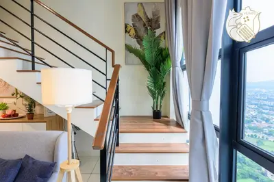 a staircase in a room with a window at Zen-Inspired Duplex Luxury 6Pax, Arte Mont Kiara by Verano in Kuala Lumpur