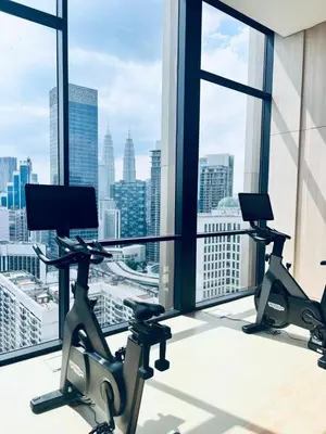 an office with a view of the city from a window at Axon Serviced Suites Kuala Lumpur in Kuala Lumpur