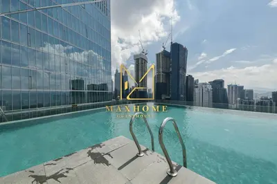 a swimming pool with a view of the city at Maxhome Cozy at Dorsett Bukit Bintang in Kuala Lumpur