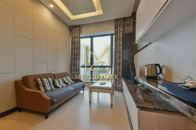 a living room with a couch and a table at Maxhome Cozy at Dorsett Bukit Bintang in Kuala Lumpur