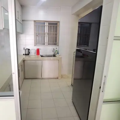 a small kitchen with a sink and a refrigerator at Warisan cityview jalan cheras 56000KL in Kuala Lumpur