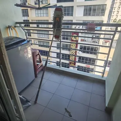 a tripod in a room with a view of a building at Warisan cityview jalan cheras 56000KL in Kuala Lumpur