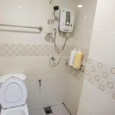 a white bathroom with a toilet and a shower at Warisan cityview jalan cheras 56000KL in Kuala Lumpur