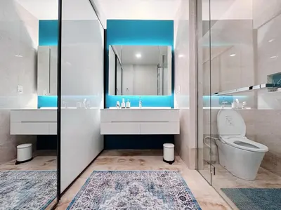 a bathroom with a toilet and a sink and a mirror at Luxury Suites at Tropicana Residences KLCC by VV in Kuala Lumpur