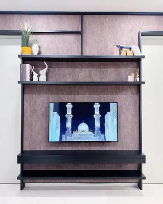 a shelf with a picture of a mosque on it at Luxury Suites at Tropicana Residences KLCC by VV in Kuala Lumpur