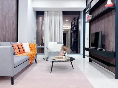 a living room with a couch and a coffee table at Luxury Suites at Tropicana Residences KLCC by VV in Kuala Lumpur