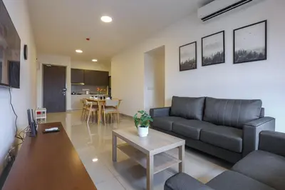a living room with a couch and a table at Lovely 3-bedroom w pool 7 pax - Jalan Cheras in Kuala Lumpur