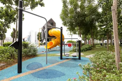 a playground in a park with a slide at Lovely 3-bedroom w pool 7 pax - Jalan Cheras in Kuala Lumpur