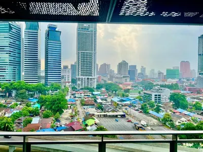 a view of a city from a window at Summer suites near klcc in Kuala Lumpur