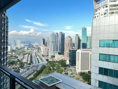 a view of a city from the balcony of a building at Summer suites near klcc in Kuala Lumpur