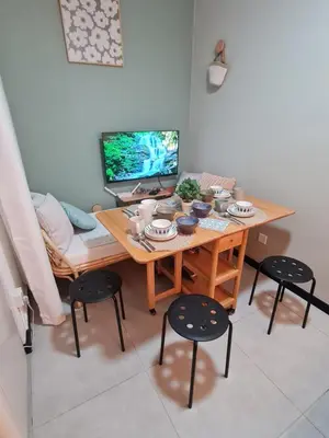 a room with a table with a computer and chairs at Cozy Modern Tiny Home 2R1B 10 mins to KLCC in Kuala Lumpur
