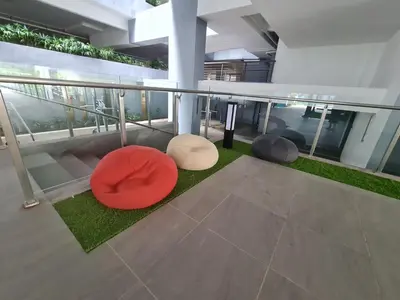 a balcony with three circular chairs on the floor at Cozy Modern Tiny Home 2R1B 10 mins to KLCC in Kuala Lumpur
